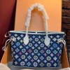 Women’s denim monogram tote bag with zipper closure and detachable shoulder strap