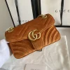 Gucci GG Marmont Velvet Mini Bag in camel brown velvet, featuring chevron pattern, gold GG plaque, heart stitching, and leather chain strap detail.