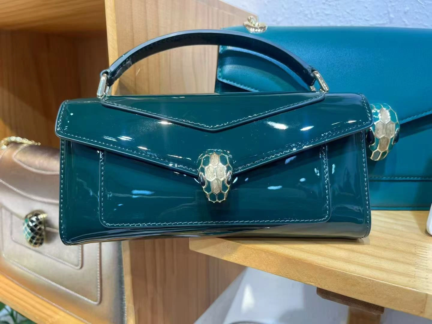 Detailed view of adjustable chain strap on Bvlgari Serpenti Forever phone bag