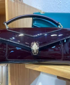 Close-up of Bvlgari Serpenti snakehead magnetic clasp with onyx eyes