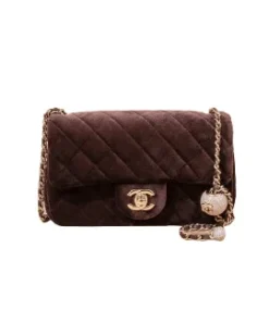 front view of leather woven chain strap with leather guard on Chanel gray felt bag