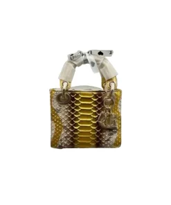 Close-up of Dior Medium Lady Dior bag showcasing golden snakeskin multicolour leather design