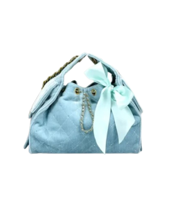 sky blue quilted bucket bag shown with included dust bag and care card.