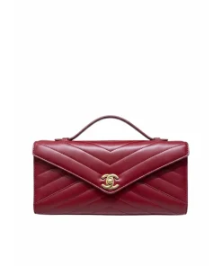Chanel burgundy quilted leather evening clutch with gold CC logo and top handle