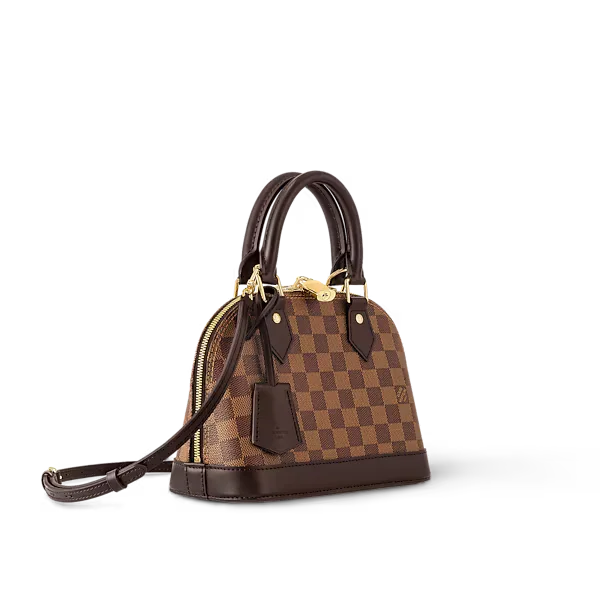 Side view of Alma BB handbag showing removable strap and gold hardware