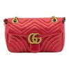 Gucci GG Marmont Velvet Mini Bag in peach pink velvet with chevron pattern, showcasing antique gold GG logo and heart detail on back
