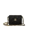 Front view of Chanel black quilted Caviar leather Wallet On Chain with gold-tone hardware and red interior