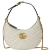 white Gucci GG Marmont mini bag with chain strap over shoulder