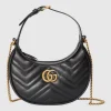 Front view of GG Marmont small shoulder bag in black style detail