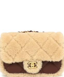 Chanel brown shearling quilted flap bag crafted with soft lambskin leather and gold CC lock