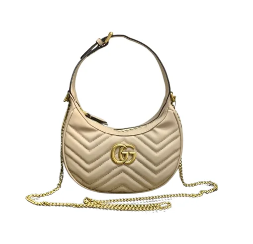 Golden beige showing the crescent shape of GG Marmont mini bag edition