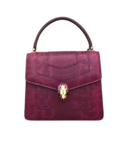 Front view of Bvlgari Serpenti Forever small handbag with signature gold snakehead closure