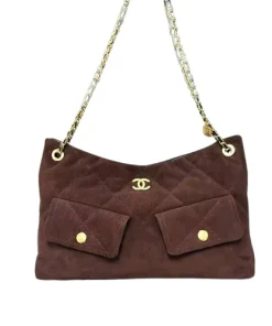 Front view of black Chanel Maxi Hobo bag showing quilted design and gold hardware