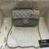 Grey quilted leather mini flap bag with chain strap and classic closure