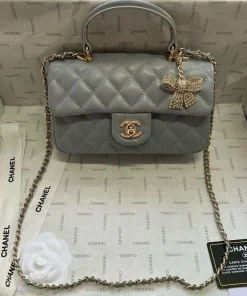 Grey quilted leather mini flap bag with chain strap and classic closure