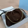 Brown suede Loewe chain shoulder bag with gold chain detail, luxury small designer handbag