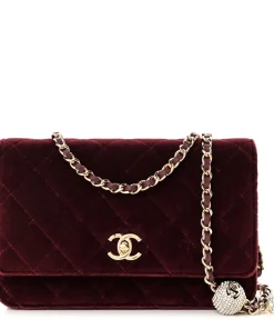 Front view of Mahroon CHANEL Velvet Quilted Pearl Crush Wallet On Chain showing CC turn-lock closure and quilted design
