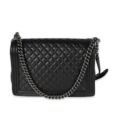 back fabric lining and storage space inside Chanel Boy Flap bag