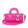 Close-up of Hot pink Dior handbag top handle and Cannage stitching detail