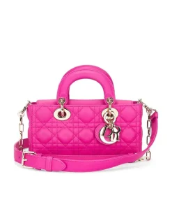 Close-up of Hot pink Dior handbag top handle and Cannage stitching detail