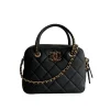 Front view of black Chanel Mini Bowling Bag with quilted lambskin leather and gold chain