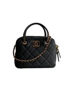 Front view of black Chanel Mini Bowling Bag with quilted lambskin leather and gold chain