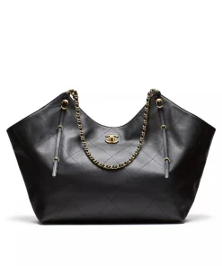 Black Chanel Coco shopping tote bag with gold chain strap and quilted leather design