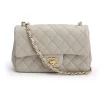 Front view of a light grey Chanel Classic Flap Bag in black quilted leather with gold-tone hardware