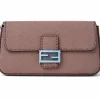 Taupe Fendi Baguette Selleria shoulder bag in Cuoio Romano leather with soft plum undertones and silver FF buckle on white background