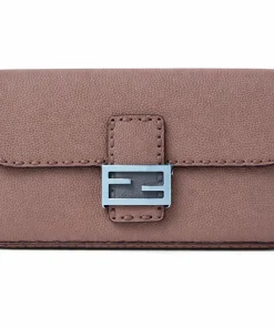 Taupe Fendi Baguette Selleria shoulder bag in Cuoio Romano leather with soft plum undertones and silver FF buckle on white background