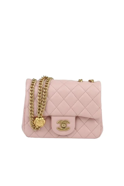Chanel mini square pearl crush flap bag in light pink quilted lambskin with adjustable chain strap and CC twist lock closure