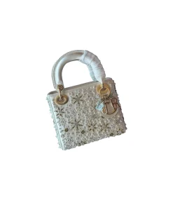 White Dior mini handbag featuring silver rhinestones, pearls, and chain handle