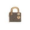 Mini Lady Dior crystal top handle bag in metallic gold calfskin with elegant structured design and gold hardware