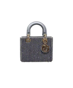 Christian Dior Mini Lady Dior crystal bag showing gold chain strap, suede interior, and refined luxury detailing