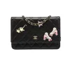 Black Premium leather Chanel wallet on chain with elegant quilted design and chain strap
