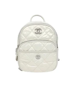 White Chanel Coco Neige nylon quilted backpack front view showing luxury designer structure and premium hardware details