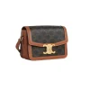 Stylish CELINE Teen Triomphe canvas bag in black and tan with adjustable shoulder strap