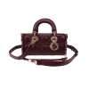 Designer Dior bag with detachable shoulder strap and hardware detail