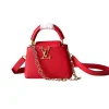 Red Louis Vuitton Capucines mini top handle bag with structured shape