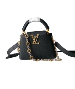 Elegant black Louis Vuitton Capucines mini crossbody bag with iconic LV logo