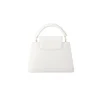 White Louis Vuitton Capucines BB bag showing organized interior compartments