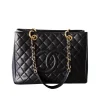 Black Chanel Medallion Tote bag with quilted caviar leather and gold chain handles