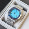 Patek Philippe inspired luxury sports watch with deep blue horizontal textured dial worn on wrist in natural lighting