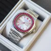 Extreme close-up of ruby-set bezel on a Swiss luxury platinum watch highlighting precision gemstone placement