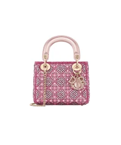 Elegant woman carrying Mini Lady Dior Bag at a formal event
