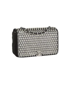 Black Chanel velvet flap bag with silver hardware and embellishments