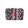 Luxury Chanel timeless flap bag with red, blue, silver, and black sequins and silver chain strap