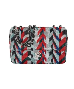 Luxury Chanel timeless flap bag with red, blue, silver, and black sequins and silver chain strap