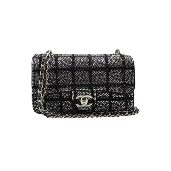 Black and silver Chanel 2025C small flap bag with crystal detailing and chain strap for shoulder wear