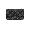 Luxury Chanel tweed classic flap bag with crystal embellishment worn on shoulder